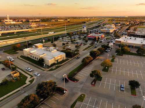 Click the Lucrative Pflugerville Commercial Real Estate Opportunities Await at Stone Hill Town Center Slide Photo to Open